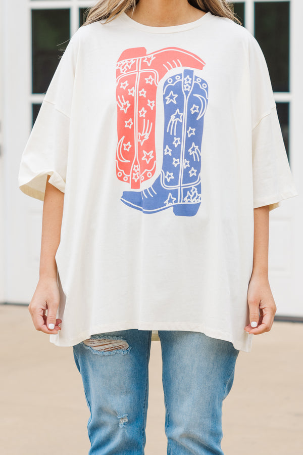 Chic Soul plus size clothing, short sleeve ivory graphic boyfriend tee with an upside down red cowboy boot and a right side up blue cowboy boot