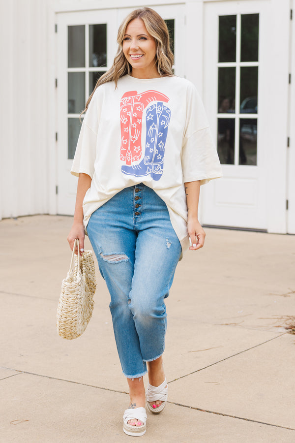 Chic Soul plus size clothing, short sleeve ivory graphic boyfriend tee with an upside down red cowboy boot and a right side up blue cowboy boot