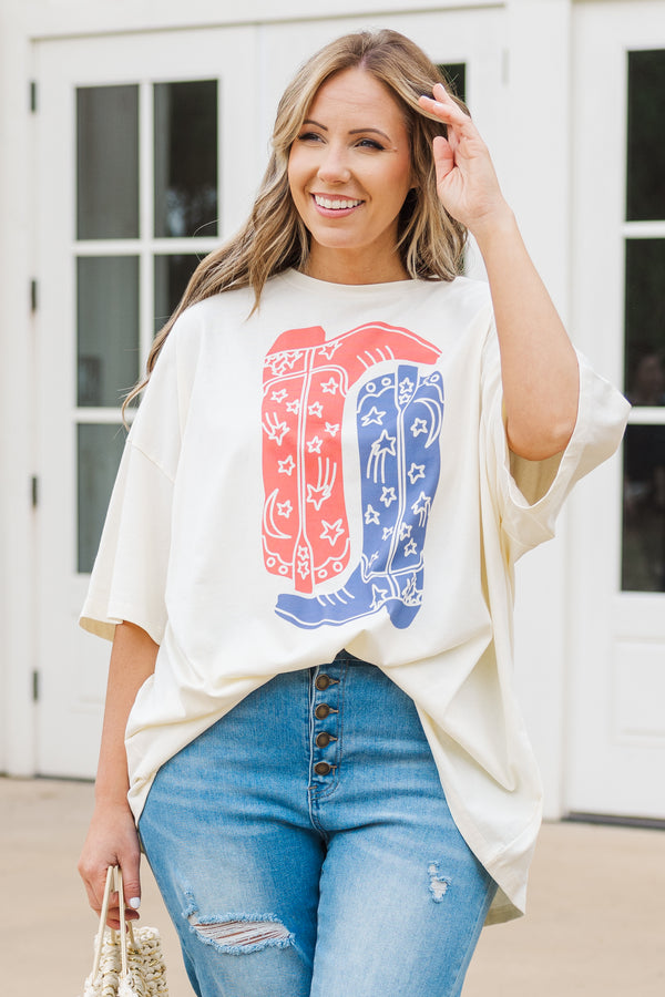 Chic Soul plus size clothing, short sleeve ivory graphic boyfriend tee with an upside down red cowboy boot and a right side up blue cowboy boot