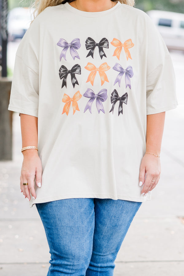 Chic Soul plus size clothing, short-sleeve dust tan graphic boyfriend tee with purple, black, and orange assorted bow graphic art 