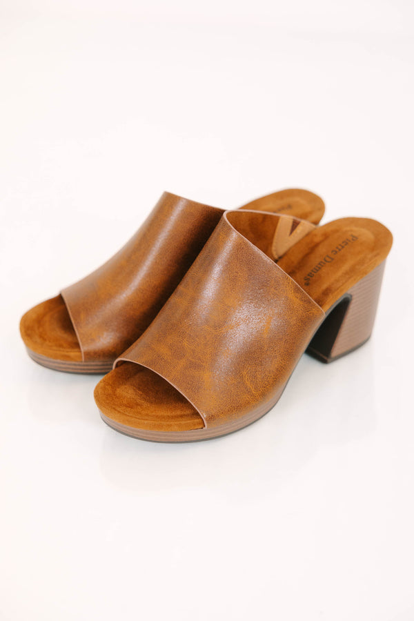 Tan mules with a block heel and open-toe leather-look strap.