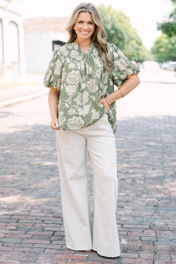 Plus Size green floral print top with elastic puff sleeves, split v-neck, and smocked shoulders.
