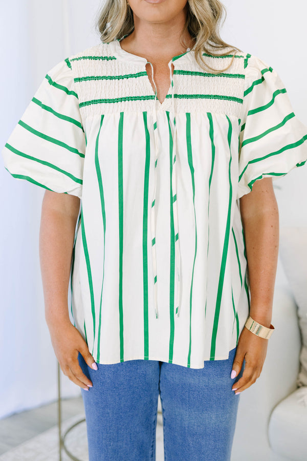 Green and white striped top with puff sleeves, split v-neck, and smocked shoulder detail.