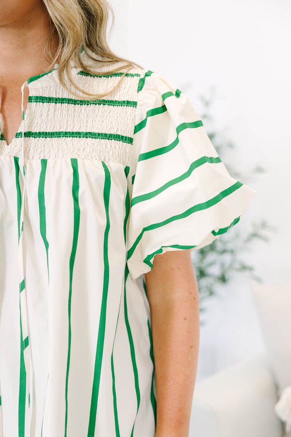 Green and white striped top with puff sleeves, split v-neck, and smocked shoulder detail.