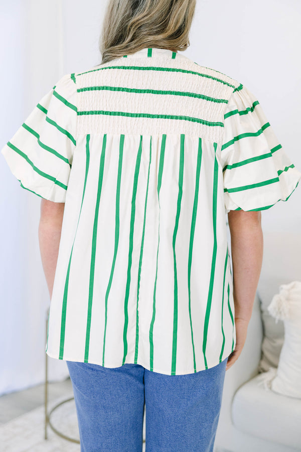 Green and white striped top with puff sleeves, split v-neck, and smocked shoulder detail.