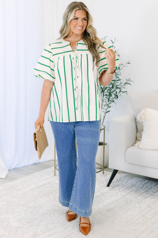 Green and white striped top with puff sleeves, split v-neck, and smocked shoulder detail.