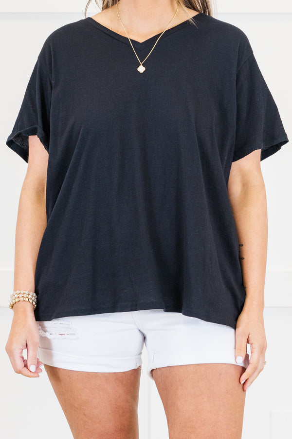 Plus Size black v-neck short sleeve cotton tee paired with white denim shorts.