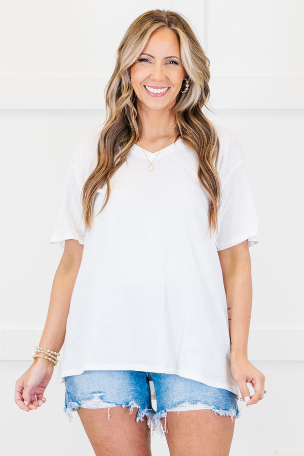 Plus Size white v-neck short sleeve cotton tee with light wash distressed denim shorts.