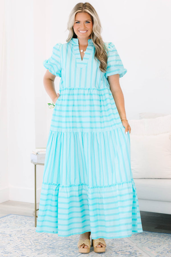 Plus Size turquoise striped maxi dress with a v-neckline, bubble sleeves, and a tiered skirt.