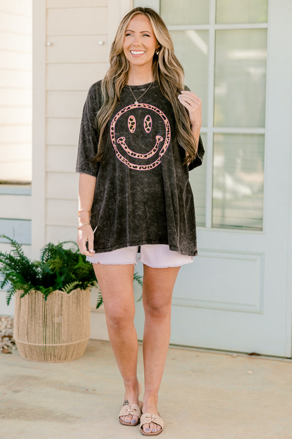 Chic Soul plus size clothing, ash black acid wash short sleeve boyfriend tee with round neckline and pink leopard print smiley graphic on the front
