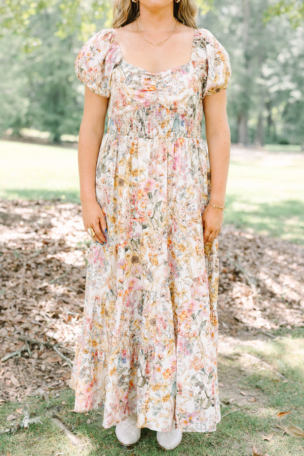 Plus Size pink floral maxi dress with puff sleeves, a smocked waist, and a tiered skirt.
