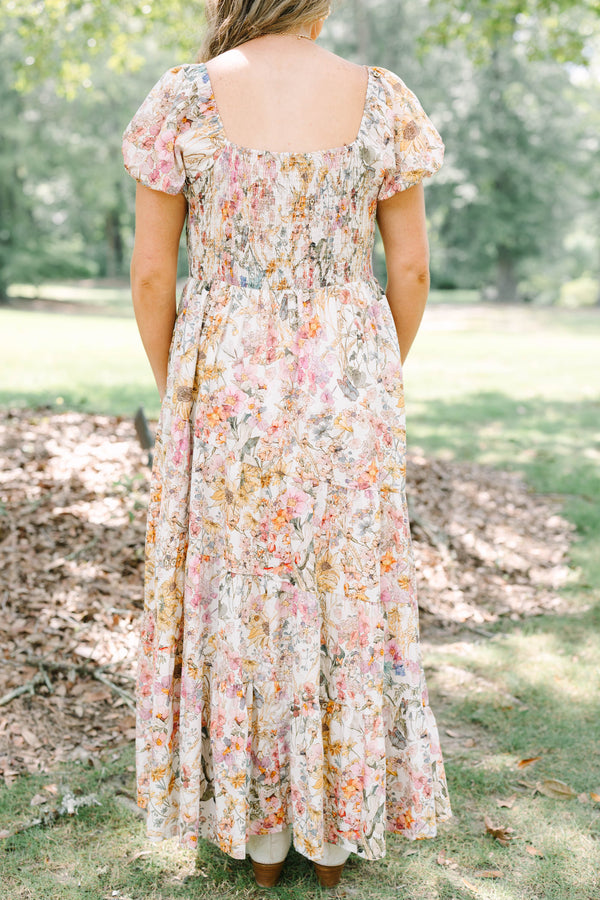 Plus Size pink floral maxi dress with puff sleeves, a smocked waist, and a tiered skirt.