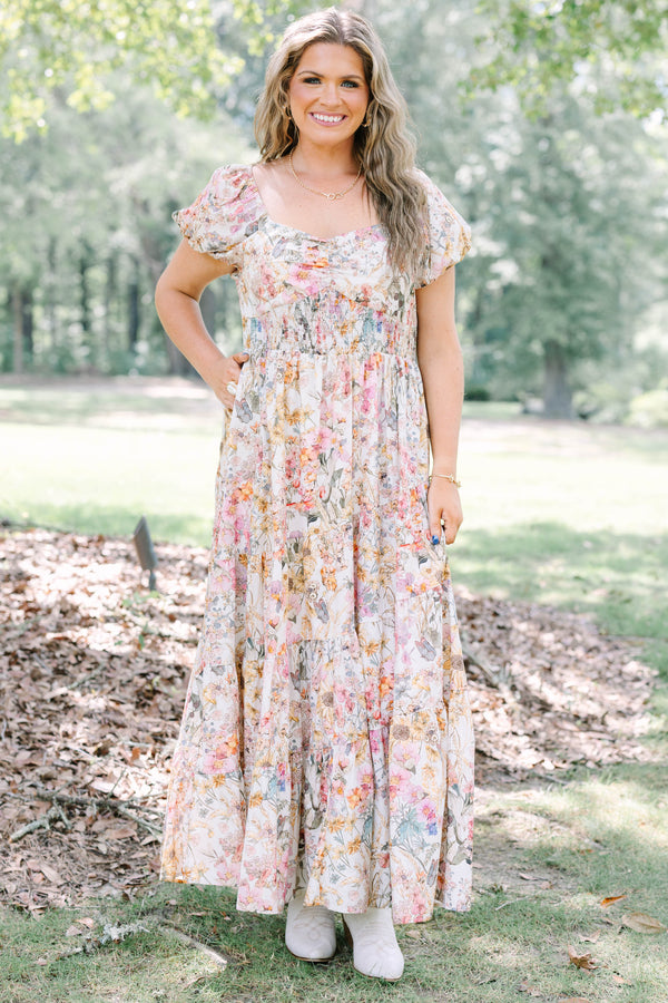 Plus Size pink floral maxi dress with puff sleeves, a smocked waist, and a tiered skirt.
