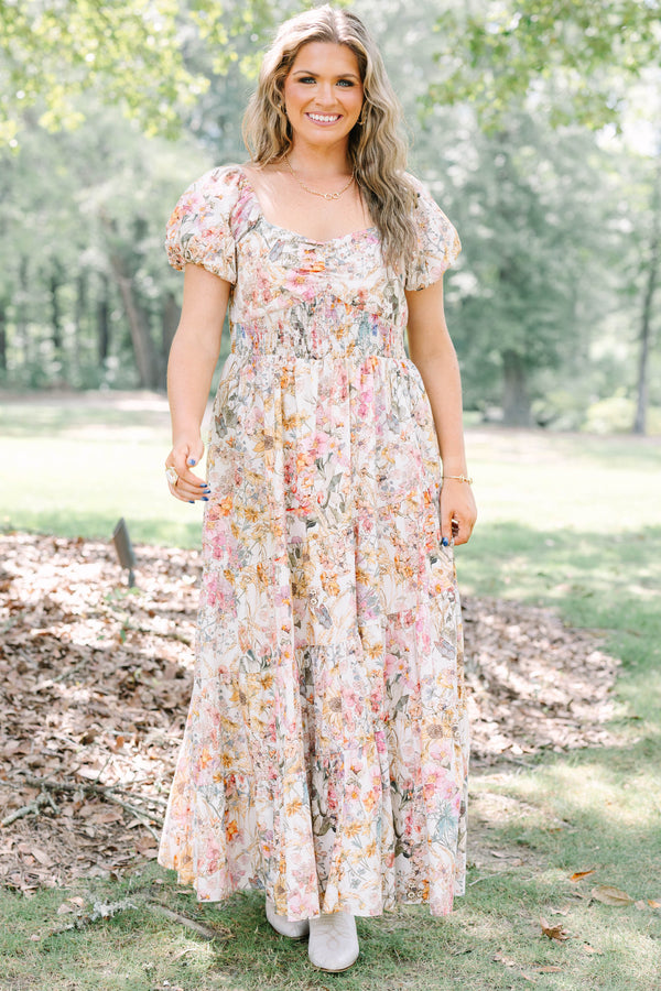 Plus Size pink floral maxi dress with puff sleeves, a smocked waist, and a tiered skirt.