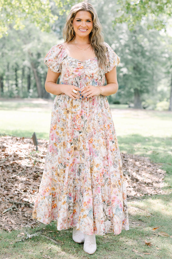 Plus Size pink floral maxi dress with puff sleeves, a smocked waist, and a tiered skirt.