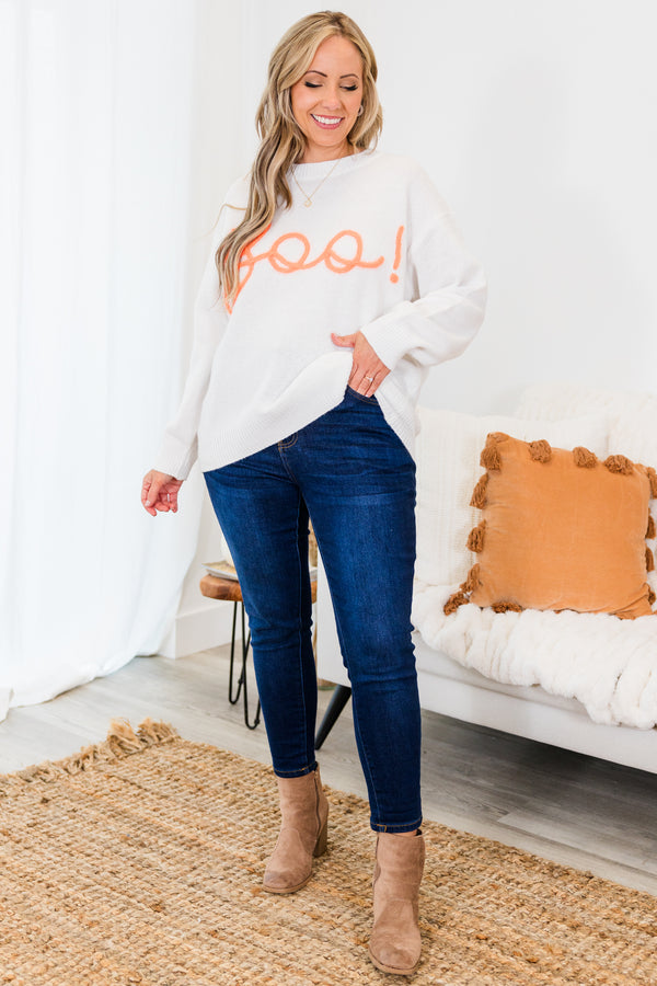 Chic Soul plus size clothing, long-sleeve crewneck white sweater with orange embroidery in cursive stating 