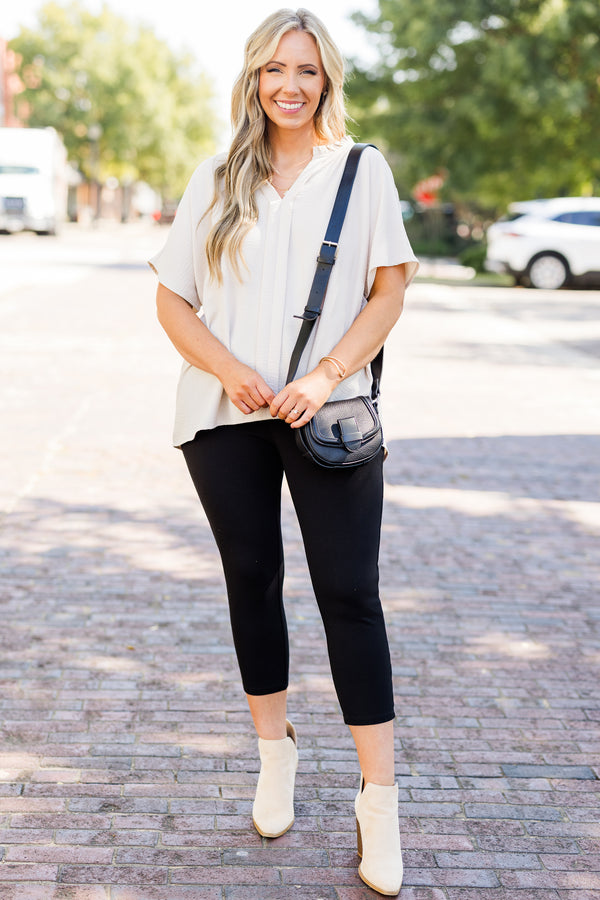 Plus Size black, stretchy cropped business pants with a wide waistband and slim fit.