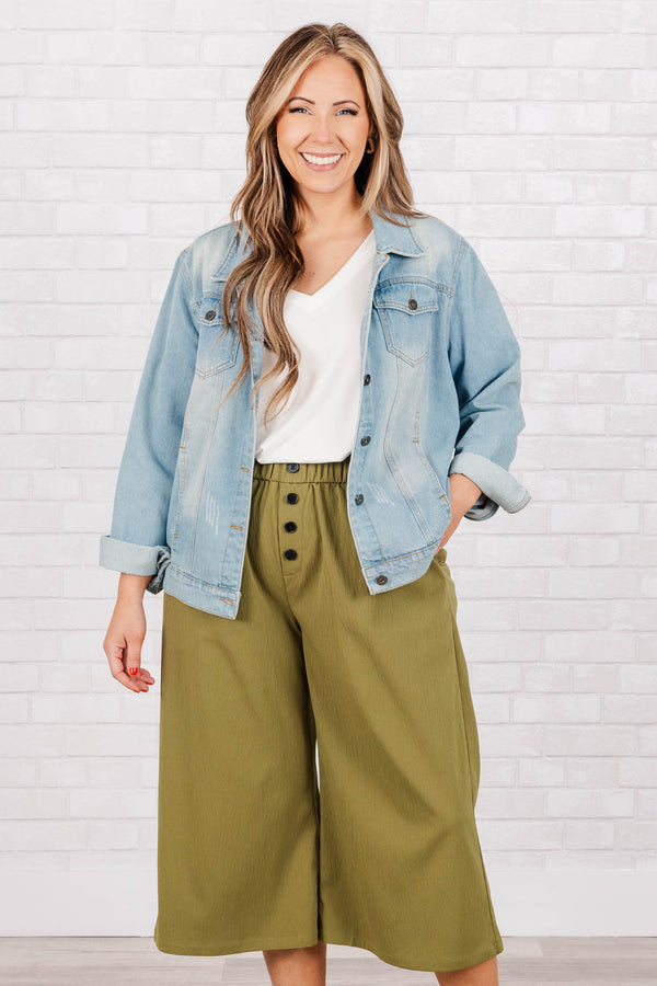 Plus Size olive green wide-leg cropped pants with an elastic waistband and four front buttons.
