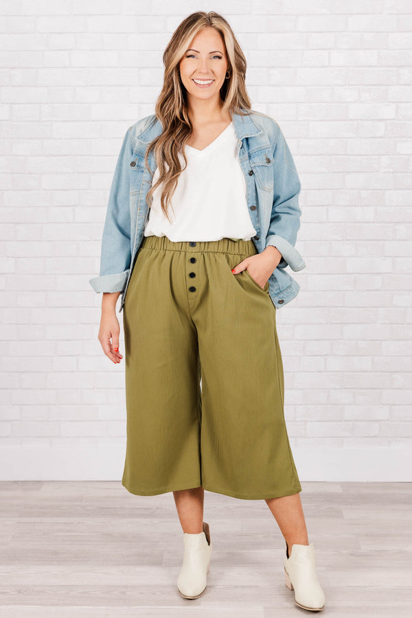 Plus Size olive green wide-leg cropped pants with an elastic waistband and four front buttons.