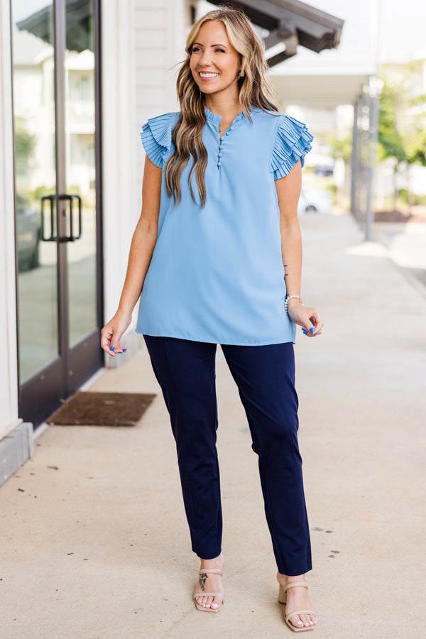 Plus Size blue top with accordion flutter sleeves and a button-up neckline.