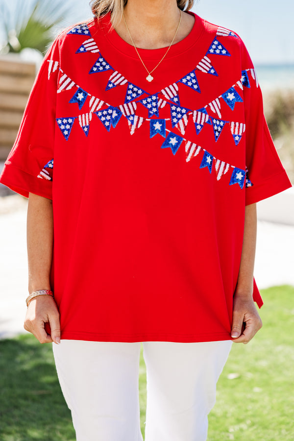 Chic Soul plus size clothing, short-sleeve drop-shoulder red top with a high-scoop-neckline with a red white and blue sequined hanging flag graphics across the bodice 