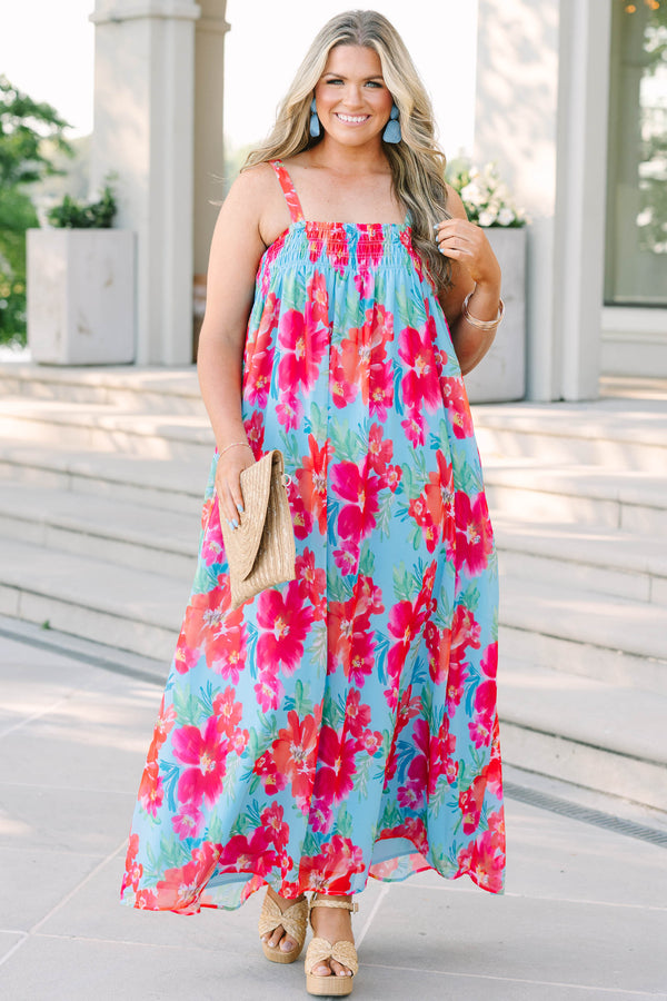 Plus Size tropical floral print maxi dress in light blue with pink and orange flowers.