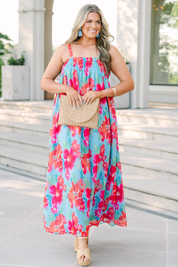 Plus Size tropical floral print maxi dress in light blue with pink and orange flowers.
