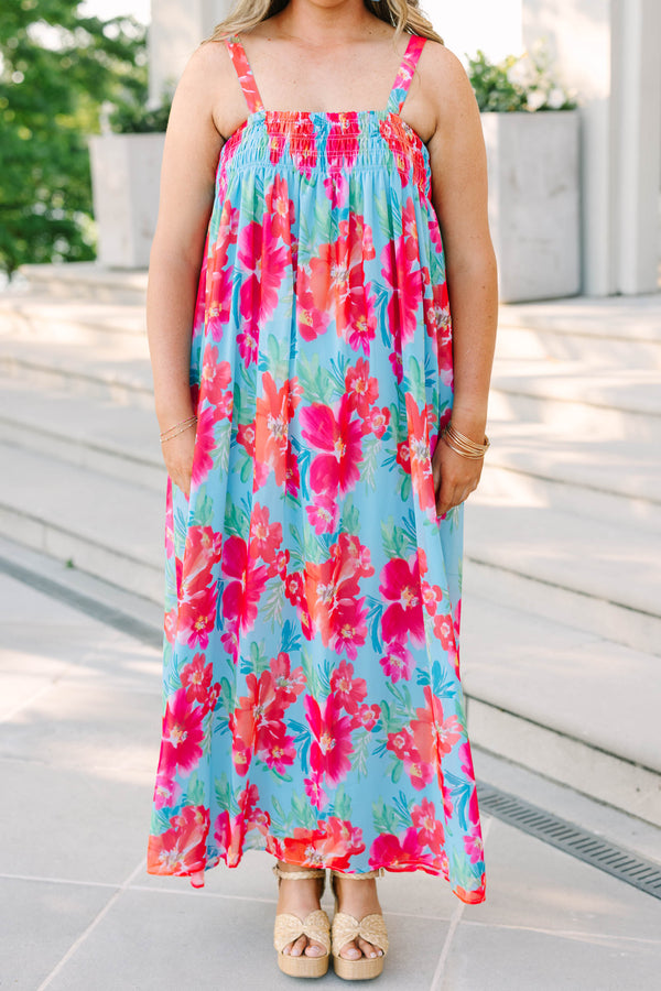 Plus Size tropical floral print maxi dress in light blue with pink and orange flowers.