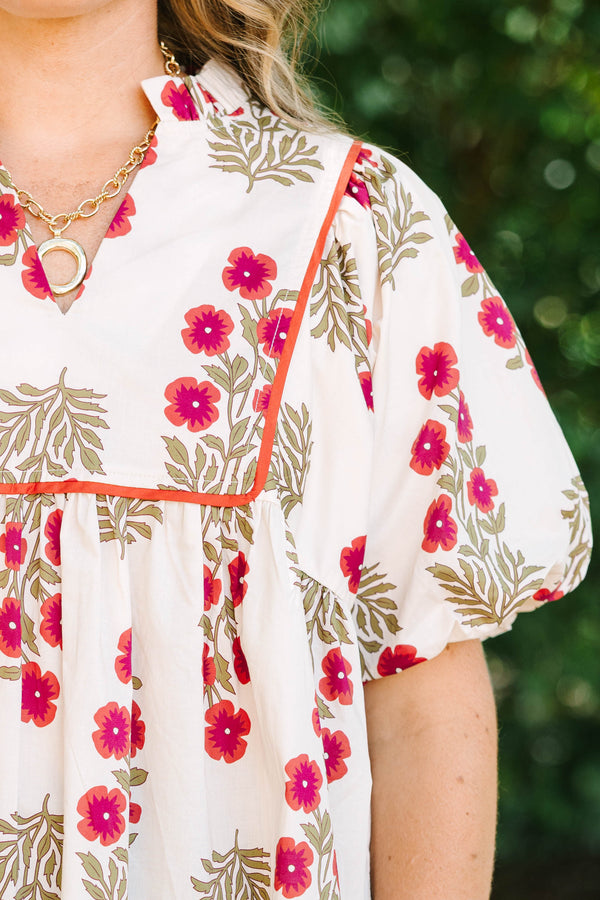 Plus Size cream babydoll top with red floral print, puff sleeves, and orange piping detail.