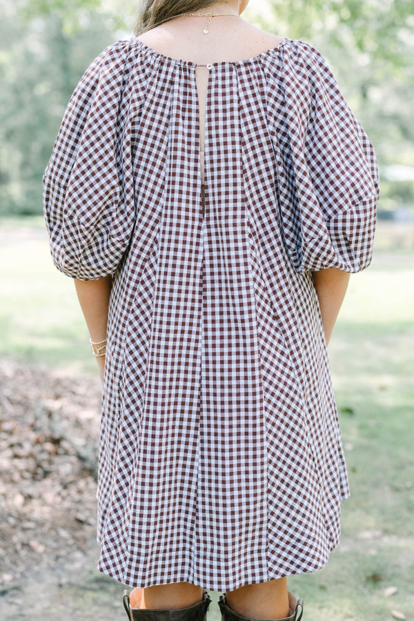 Plus Size brown and white gingham cotton dress with puff sleeves and a tie-front neckline.