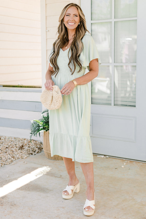 Plus Size sage green midi dress with a smocked bodice, flutter sleeves, and a tiered ruffle hem.
