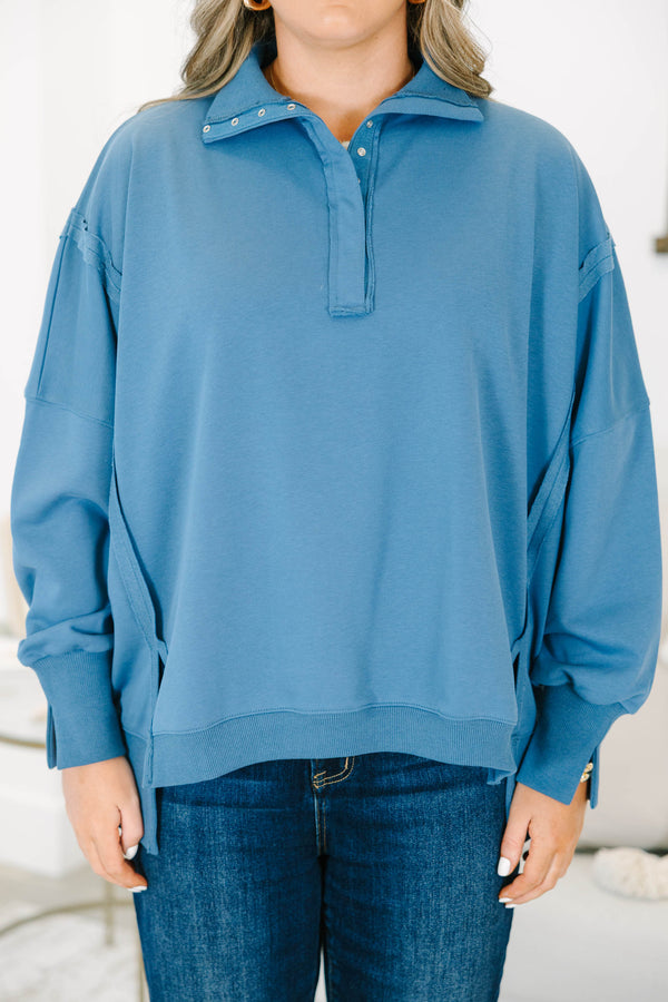 Plus Size blue long-sleeve pullover with a collared snap-button neckline and ribbed trim.