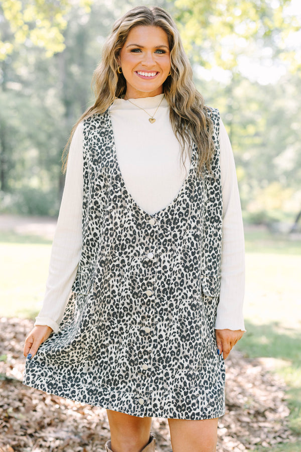 Plus Size leopard print button-front jumper dress over a white long-sleeve turtleneck top.