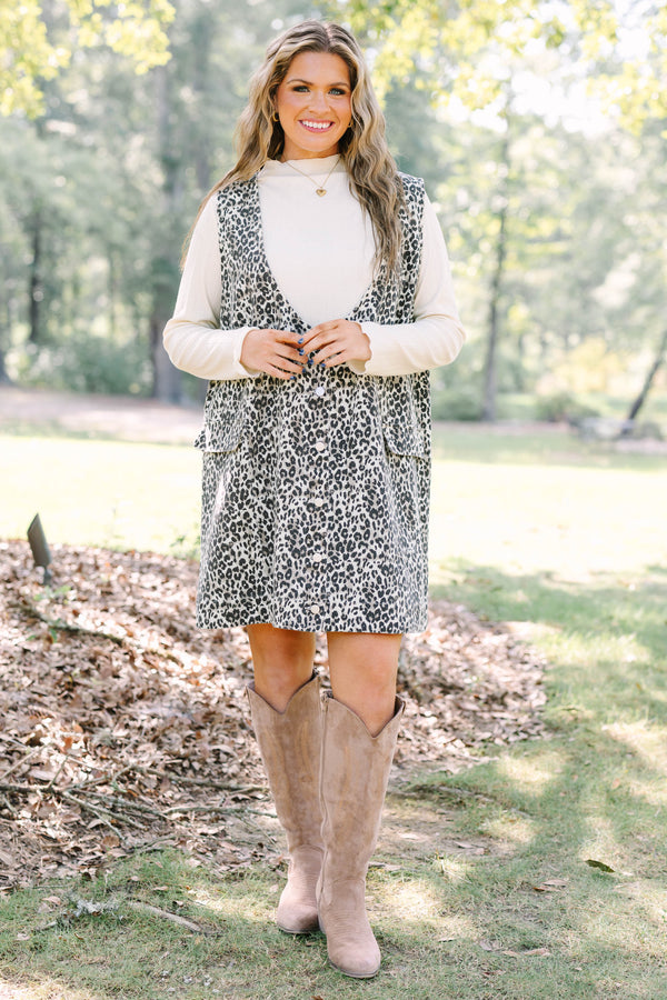 Plus Size leopard print button-front jumper dress over a white long-sleeve turtleneck top.