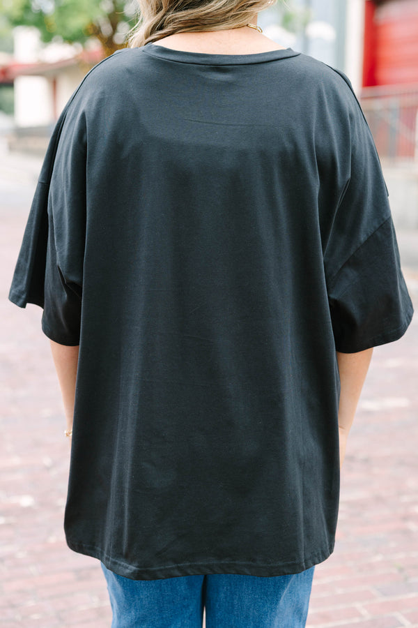 black oversized boyfriend tee with a checkered pumpkin graphic