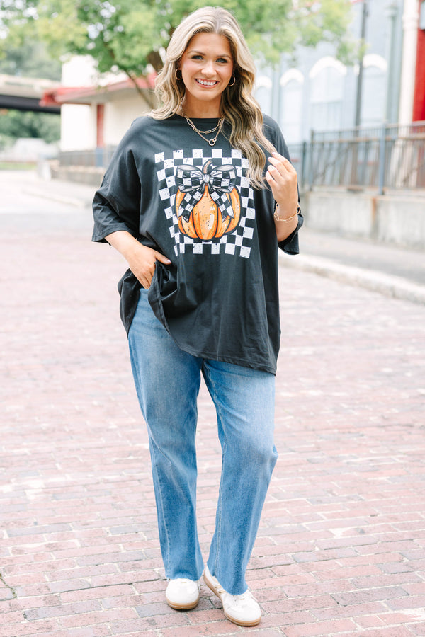 black oversized boyfriend tee with a checkered pumpkin graphic
