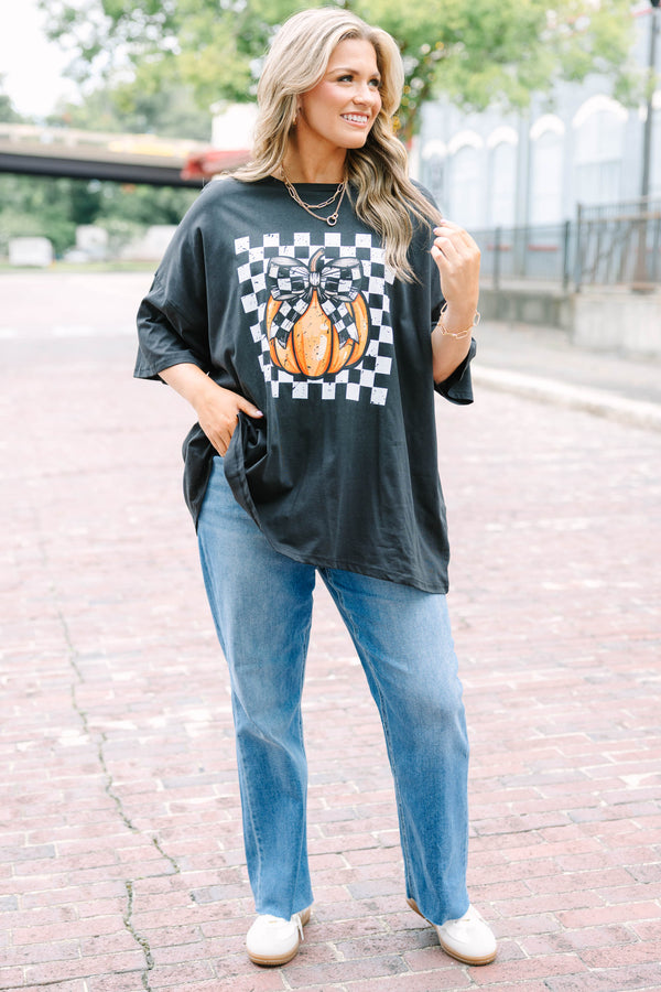 black oversized boyfriend tee with a checkered pumpkin graphic
