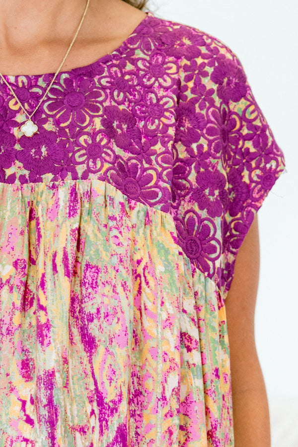 Chic Soul plus size clothing, magenta multi patterned short sleeve top with magenta embroidery along chest with round neckline
