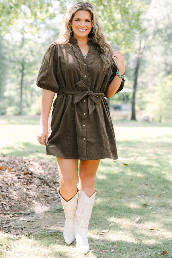 Plus Size brown corduroy mini dress with scalloped button front, puff sleeves, and a tie waist.
