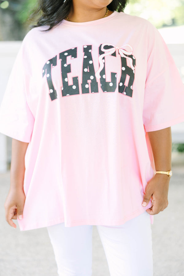 Plus size dusty pink boyfriend tee with polka dot 'TEACH' graphic, oversized 100% cotton fit.