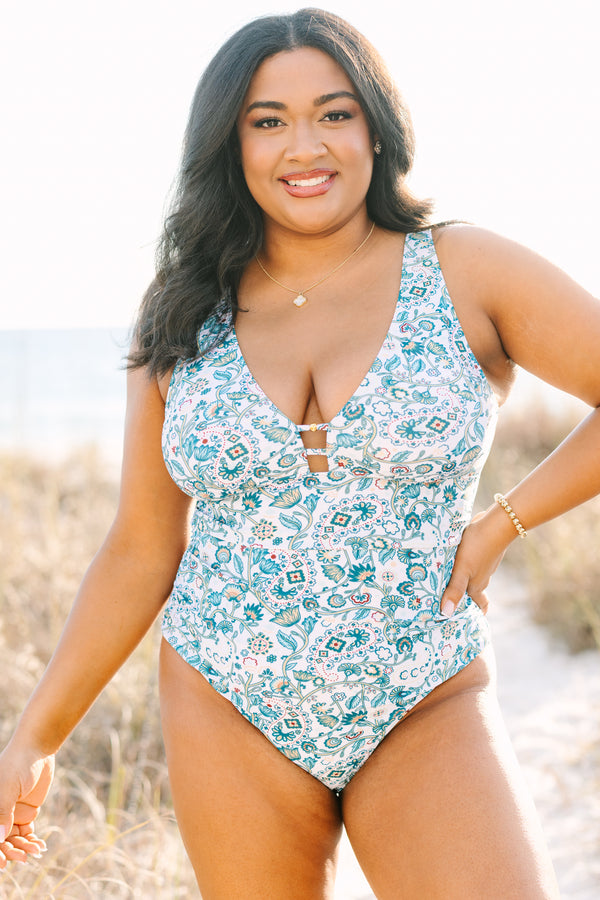 Chic Soul plus size clothing, white one piece with a multi color blue floral pattern and  a deep v-neckline 