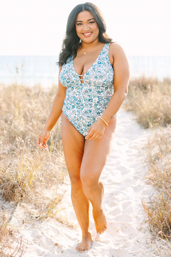 Chic Soul plus size clothing, white one piece with a multi color blue floral pattern and  a deep v-neckline 