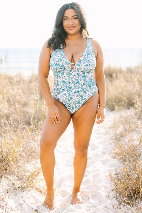 Chic Soul plus size clothing, white one piece with a multi color blue floral pattern and  a deep v-neckline 