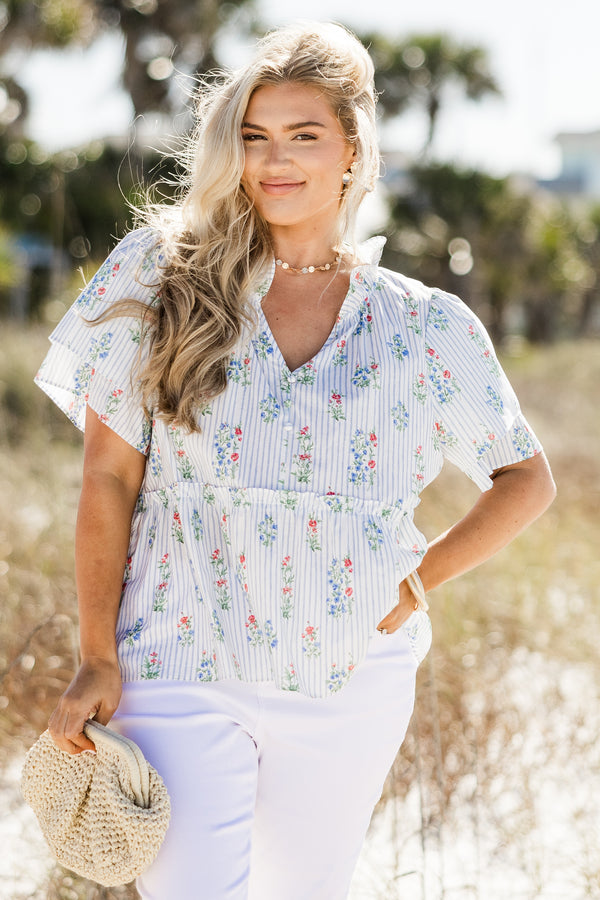 Chic Soul plus size clothing, blue and white stripe babydoll top with blue and red floral pattern, collar, and flutter sleeves