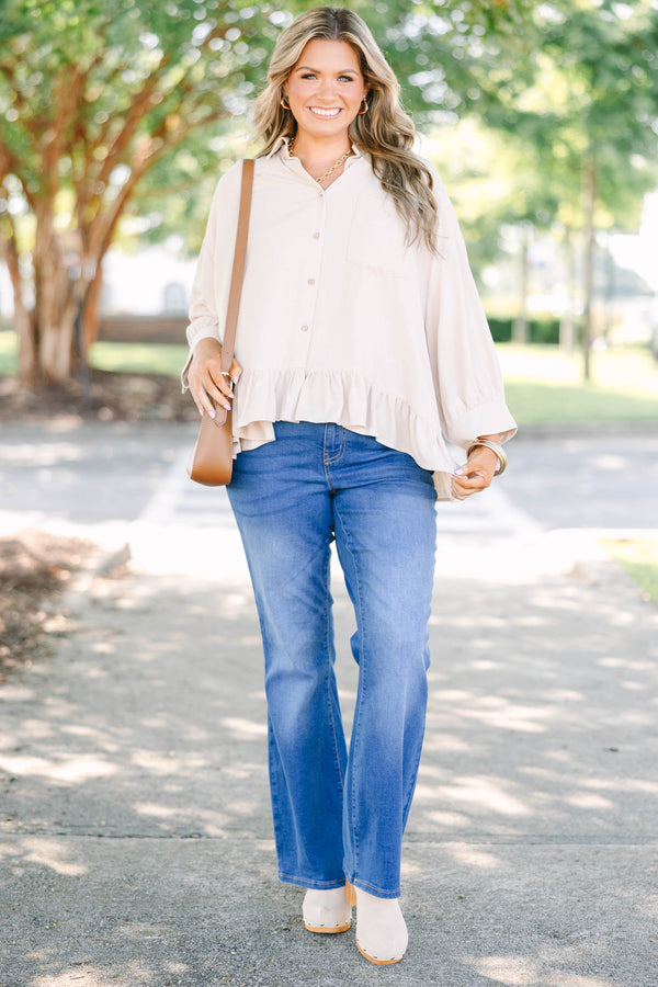 Plus Size medium wash flare jeans with a high-rise fit and classic five-pocket styling.