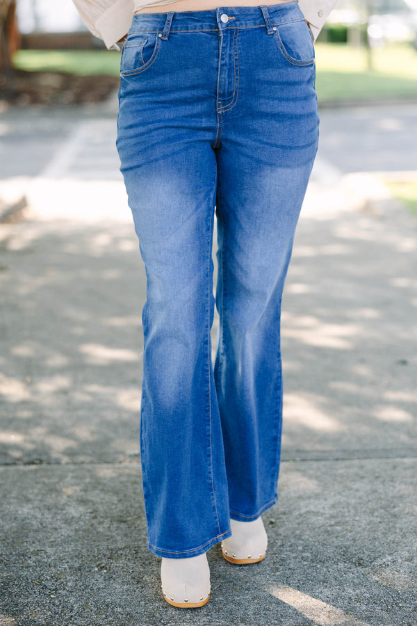 Plus Size medium wash flare jeans with a high-rise fit and classic five-pocket styling.