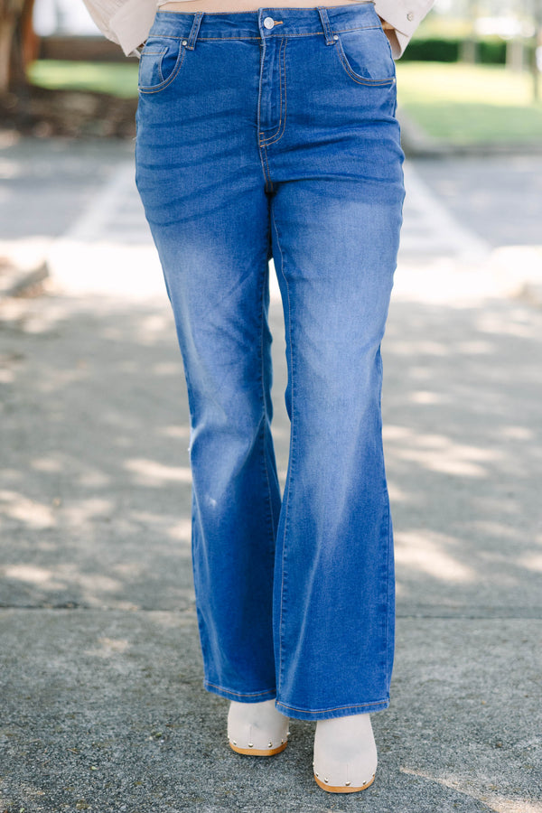 Plus Size medium wash flare jeans with a high-rise fit and classic five-pocket styling.