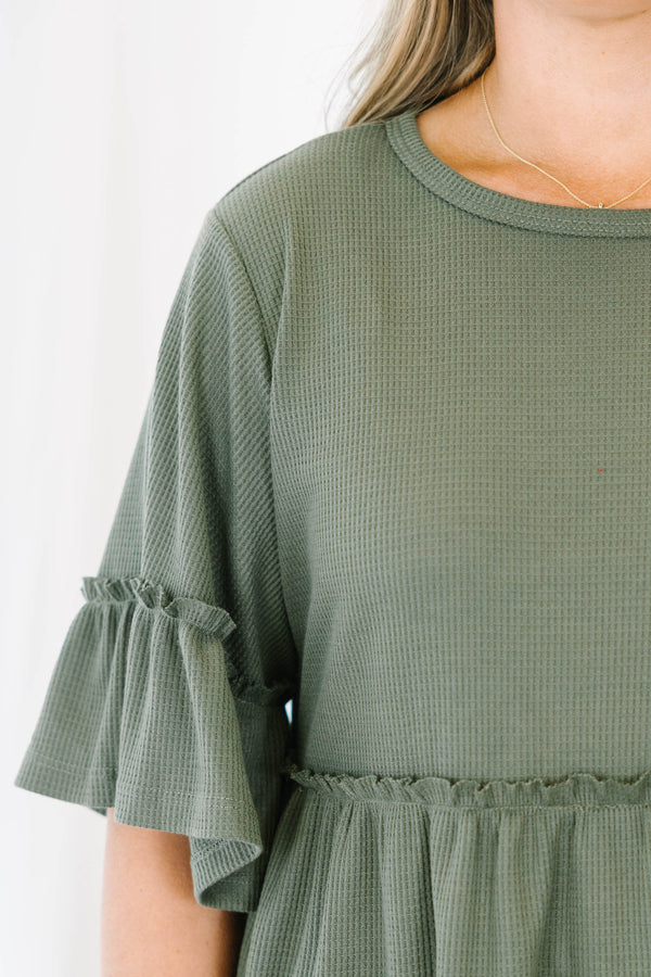 Chic Soul plus size clothing, Olive baby doll top that has short sleeves and small ruffling across the chest and on top of the sleeves 