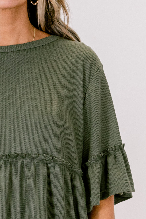 Chic Soul plus size clothing, Olive baby doll top that has short sleeves and small ruffling across the chest and on top of the sleeves 
