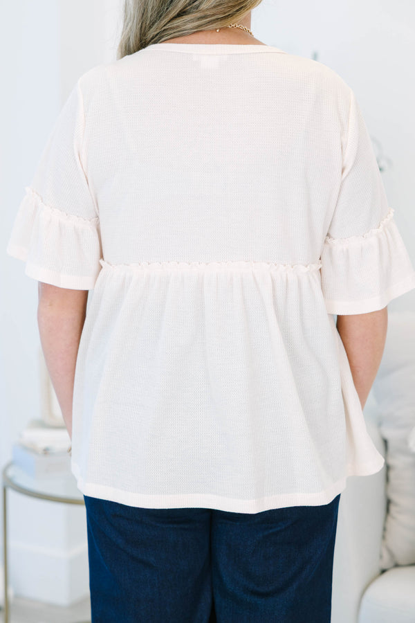 Plus Size taupe waffle knit babydoll tunic with ruffled bell sleeves.